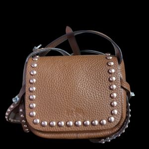 Rare Dakotah 15 in pebbled leather and Rose gold Rivets